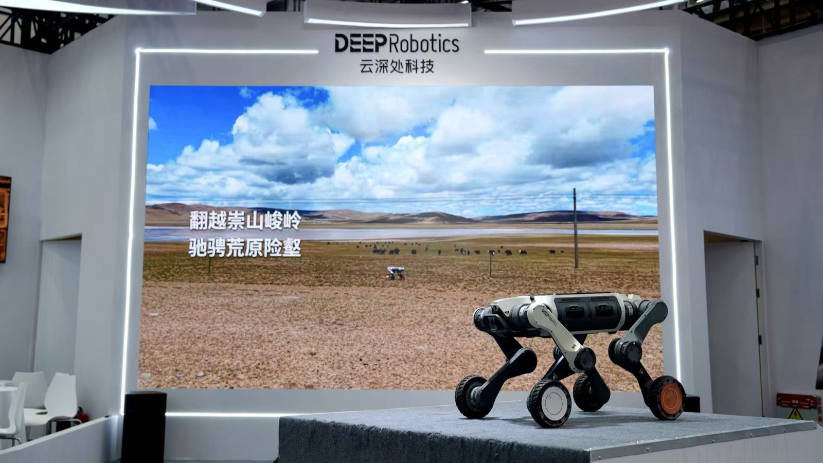 DEEP Robotics S10 wheel-leg scout robot demonstrating on stage at WRC 2026 Beijing